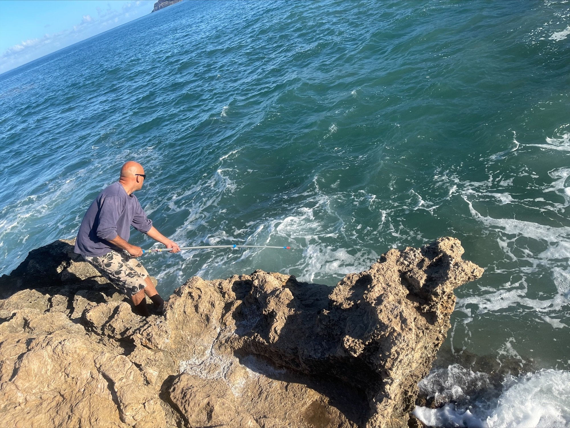 samples being taken at Pokai bay by volunteer