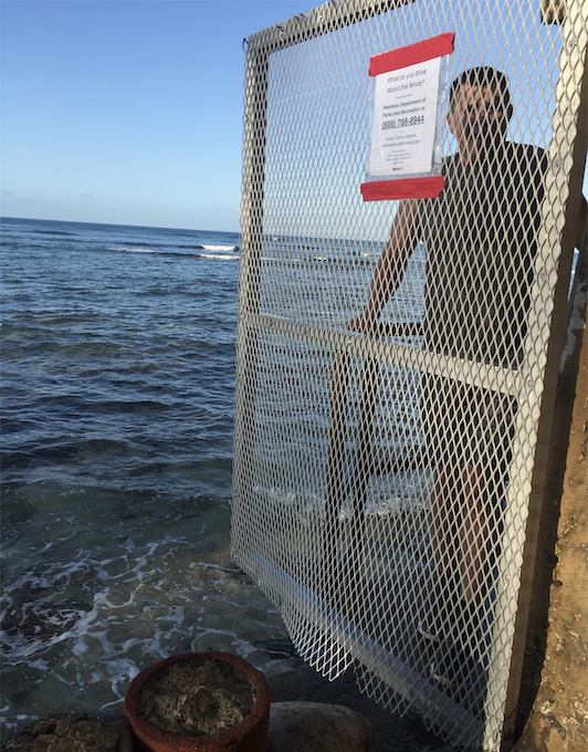 gate blocking beach access